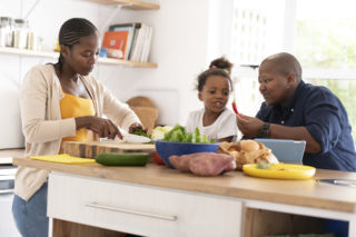 A family cooking in the kitchen together