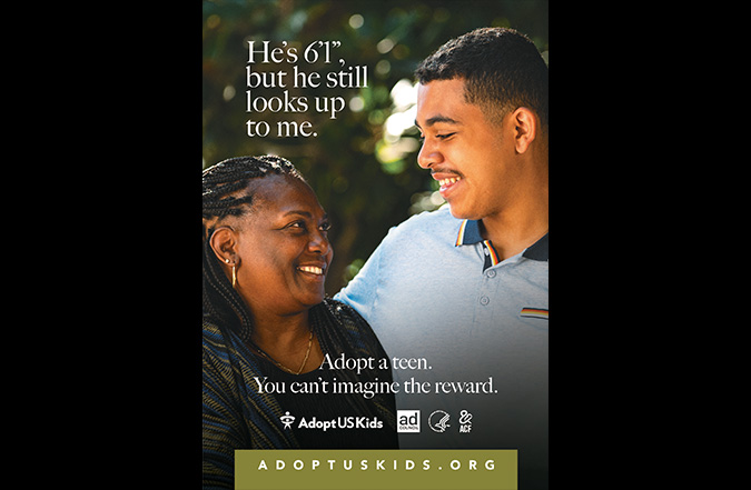 A mother looks up to her taller son, with the words appearing over the photo of the two reading, "He's 6'1., but he still looks up to me." It then features the tagline, "Adopt a teen. You can't imagine the reward."