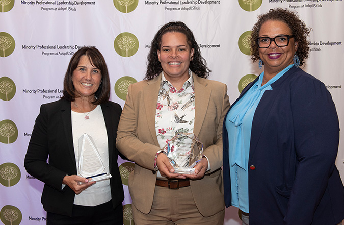 MPLD graduate Phoenix Santiago poses for a photo with two Health and Human Services representatives to celebrate her graduation from the prestigious leadership fellowship, MPLD.